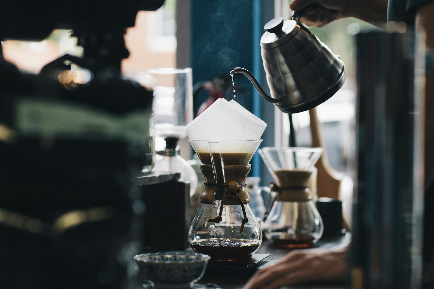Freshly brewed coffee and coffee beans on a wooden table